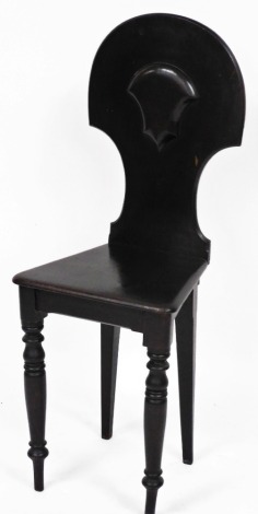 A Victorian stained dark oak shield back hall chair.