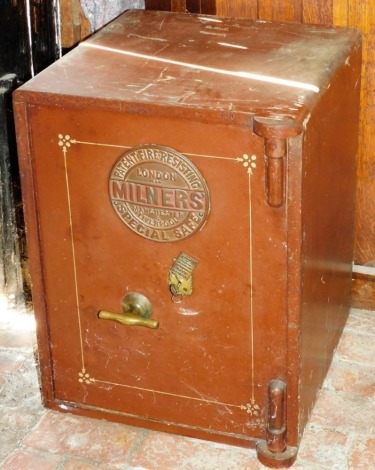 A Milners brown cast iron safe, with key, 64cm high, 49cm wide, 52cm deep.