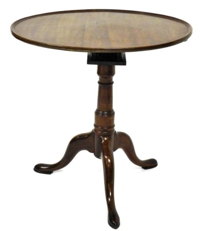 A walnut occasional table, the oval galleried top sitting on a bird cage, with turned column and tripod base, 70cm wide.