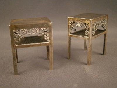 A pair of Chinese miniature silver two tier tables