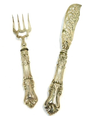 A set of Victorian silver fish servers, comprising knife and fork, with heavy foliate scroll loaded handles, bearing the initials GFFP, Birmingham hall marks rubbed, 7oz gross.