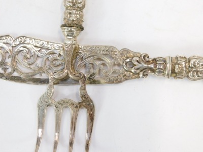 A set of Victorian silver fish servers, comprising knife and fork, with heavy foliate scroll loaded handles, bearing the initials GFFP, Birmingham hall marks rubbed, 7oz gross. - 2