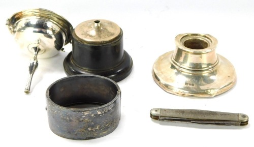 A group of silver wares, comprising of George V silver Capstan inkwell, with loaded base, (AF), a Victorian engraved silver bangle, with bird, and a silver trophy for the Boy's Single Champion John Newton, on a weighted base, (AF), ½oz, and a penknife. (