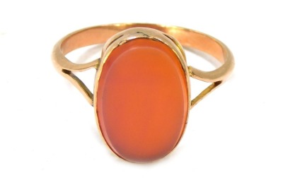 A signet ring, with oval faceted orange bloodstone, in a yellow metal setting stamped 9ct, size R, 2.6g all in.