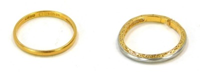 Two 22ct gold wedding bands, comprising one of plain design, size L, 1.4g, the other cut and outer polished with floral design, 2.8g. (2)