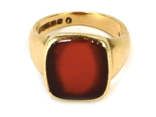 A 9ct gold orange agate gentleman's signet ring, with a rectangular set stone in rub over setting, size S½, 8g all in.