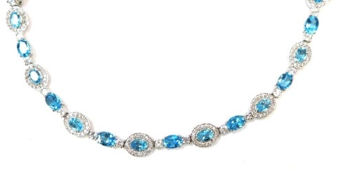 A silver blue zircon and CZ set bracelet, with oval links, 15.1g all, 21cm long,