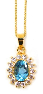 A blue zircon and diamond set cluster pendant, the pendant with central blue zircons surrounded by tiny diamonds, 2cm high, on a fine link neck chain, yellow metal stamped 750, 26cm long, 4g all in, boxed.