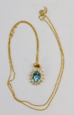 A blue zircon and diamond set cluster pendant, the pendant with central blue zircons surrounded by tiny diamonds, 2cm high, on a fine link neck chain, yellow metal stamped 750, 26cm long, 4g all in, boxed. - 2