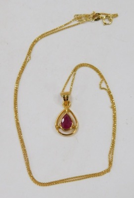 A ruby pendant and chain, the tear drop shaped pendant set with central faceted stone, on a fine link neck chain, yellow metal stamped 750, 44cm long, 3.9g all in, boxed. - 2