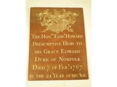 An 18thC brass rectangular plaque engraved with a crest and inscribed The