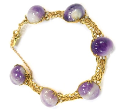 A 9ct gold amethyst bracelet, with polished cabochon stones and daisy link bracelet, the sliding clasp and safety chain approximately 14cm long, 22.2g all in. (boxed)