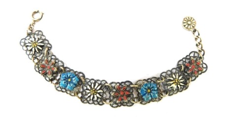 A continental enamel bracelet, with square set filigree type links, with blue, white and red enamel flowers to centre, white metal stamped 925, 13cm long, 7.5g all in.