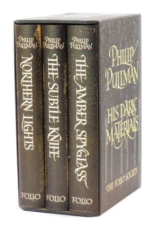 Pullman (Philip). Northern Lights, The Subtle Knife and The Amber Spyglass, 3 volumes in slip case published by the Folio Society.