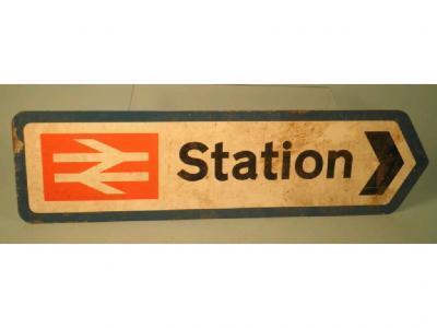 A painted railway sign with British Rail emblem within a turquoise border