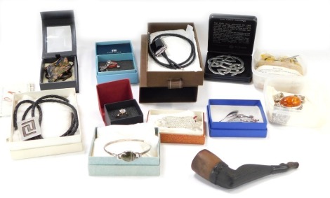 A group of costume jewellery, comprising a silver and imitation amber pendant and earring set, novelty lady's leg pipe, a paste stone set dog brooch, bangles, etc. (1 tray)