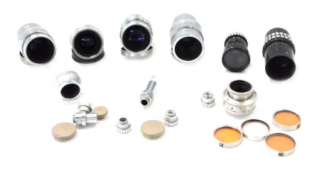 A group of camera lens, comprising The Taylor & Hobson No 557624, 587090, The Pelotal 6.5mm lens, No 543467, a Dallmeyer wide angle 6.5mm lens, and Dallmeyer No 498167 lens, together with a small group of other accessories and caps. (a quantity)