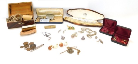 A group of costume jewellery, comprising faux pearl necklaces, brooches, silver crucifix and chain, Ronson lighters, lipstick holder, empty Rolex box, etc. (1 tray)