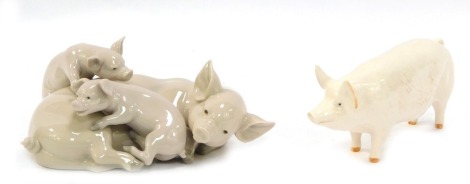 A Beswick figure of Pig C H Wall, and a Lladro pig and piglet group, 18cm long. (2)