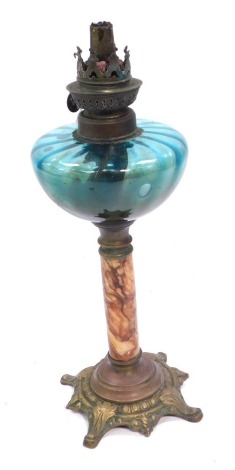 A Victorian glass oil lamp, with a turquoise glass shade on turned marble effect column, with brass base, 33cm high.