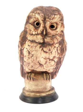 A Chelsea pottery figure of an owl, on socle, printed marks beneath, 33cm high.