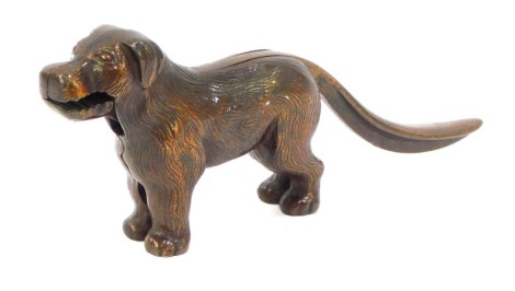 A 20thC standing bronze effect cast iron dog nutcracker, with articulated mouth and tail.