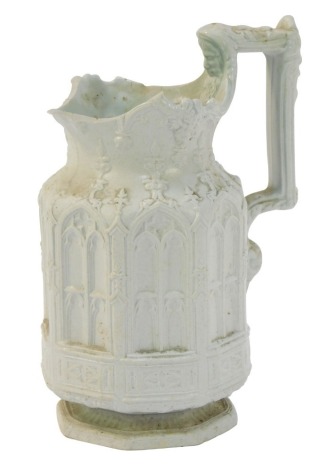 A Charles Keist of Handley salt glazed jug, of ecclesiastical design with angular handle, with repeat patterns, on a shaped foot, raised mark beneath, 22cm high. (AF)