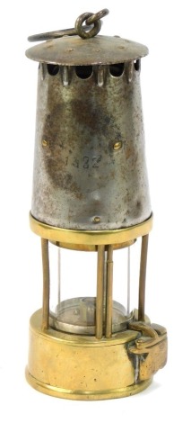 A 20thC miner's safety lamp, with brass lower section, partially glazed, No 1332, 22cm high.