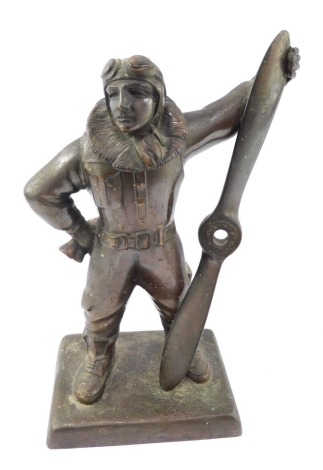 An aviation table lighter, of a pilot holding propeller, with detachable head, 30cm high. (AF)