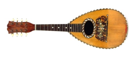 An early 20thC French rosewood mandolin, with mother of pearl and imitation tortoiseshell applied detail, label for Jerone Thibouville Lanny & Co 'Phebe', lacking strings, 60cm long.