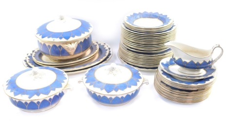 A Booth's powder blue Lilly pattern part dinner service, comprising large tureen, two small tureens, set of four graduated meat plates, serving plates, nine large dinner plates, twelve medium plates, twelve side plates, four bowls and a gravy boat and sau