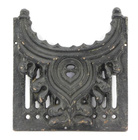 A cast iron part fire grate, with scroll and fleur de lis panel, 31cm x 28cm.