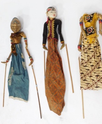 A group of Eastern hardwood puppets, each of varying design with heavy gilt painted detail, some with strings. (a quantity) - 2