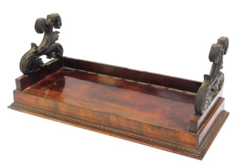 A 19thC mahogany book stand, with two scroll ends and a galleried top, with bead and reel border, 23cm high, 51cm wide, 24cm deep.