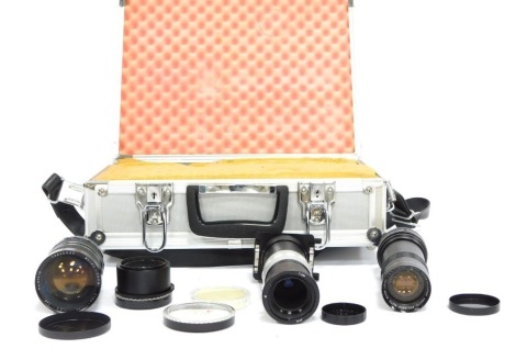 Camera equipment, to include Polaris auto zoom lens, 1-5.8, Panagor zoom slide duplicator, lens caps, Travenar 37mm-105mm lens, etc, all enclosed in an aluminium camera case.