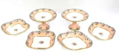 A late 19thC/early 20thC Aynsley part dessert service, comprising two cake plates, two serving plates and two square set serving bowls, each with a black Greek key type border, pink and rose pattern with gilt frames. (6)