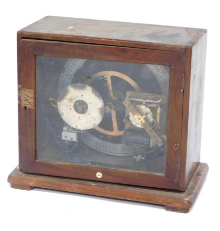 A Gant's of Leicester bell and time circuit machine, with three dials, time, sound and date, in a mahogany fitted case, with glazed door, 47cm wide, 24cm deep.