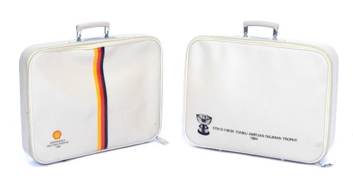 Two Shell Company cream leather travel cases, comprising The Golf Piala PFRPATIH 1985, and The Fifth DYMM TUNKU AMPUAN NAJIHAH Trophy 1984, 40cm high, 50cm wide, 10cm deep. (2)