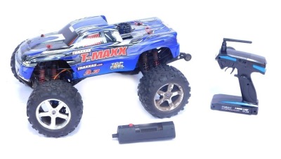 BT - A Traxxas T Max remote control monster truck, with two channel 2.4GHZ controller.