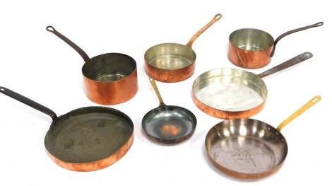 A group of 19thC copper pans and skillets, all unmarked, various sizes, the largest 32cm diameter, the smallest 19cm diameter. (7)