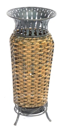 An Eastern inspired rattan and metal umbrella stand, rattan body, 63cm high.