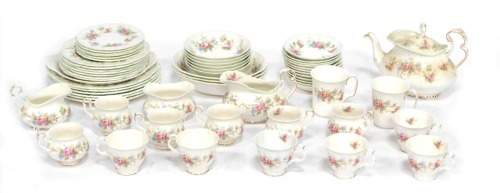 A Royal Albert part tea and dinner service in the Colleen pattern, comprising teapot, two beakers, two milk jugs, sugar bowl, two sets of six cups, twelve saucers, six bowls, three serving bowls, six side plates, six dinner plates, six large plates and a