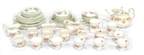 A Royal Albert part tea and dinner service in the Colleen pattern, comprising teapot, two beakers, two milk jugs, sugar bowl, two sets of six cups, twelve saucers, six bowls, three serving bowls, six side plates, six dinner plates, six large plates and a 