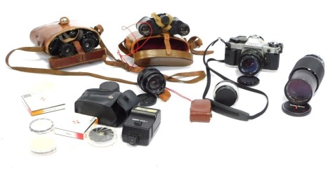 Various camera equipment, comprising a Vivitar automatic tele converter 2X-4 lens, Vivitar 28mm lens and flash, Canon AE1 camera and 50mm lens, Vivitar Series 1 70-210mm lens, London Mark II binoculars, set of unmarked binoculars, all in leatherette carry