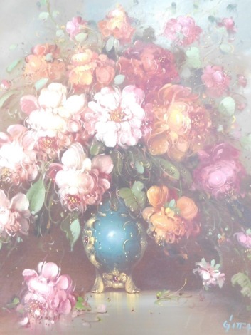 Gitta (21stC School). Flowers in a blue vase, still life, oil on canvas, signed, in gilt white frame, frame 60cm x 50cm.