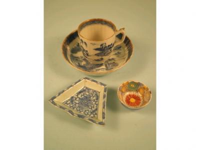 An early 19thC Chinese blue and white cup and saucer