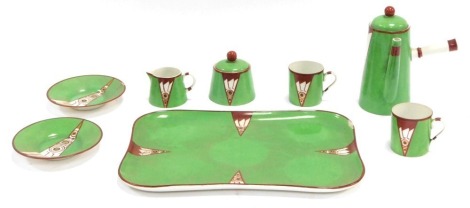 A Limoges Art Deco porcelain part coffee set and tray, signed to the reverse P. Bastard, the tray 29cm wide, (AF)