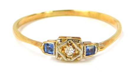 An 18ct gold diamond and sapphire Art Deco ring, the central platinum panel set with tiny diamond and two square cut sapphires, size S, 1.4g all in.