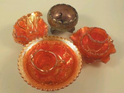 A quantity of carnival glass to include a bowl decorated with acorns