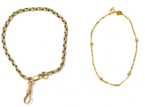 Two bracelets, comprising a 9ct gold ball bracelet, 16cm long, a watch chain, with clip clasp, 14cm long, 7.4g all in. (2)